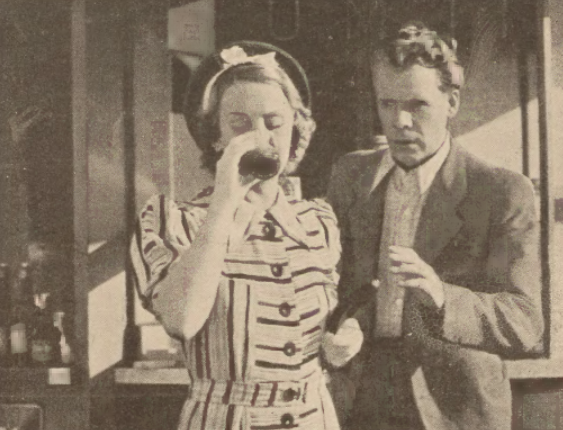 A. Żeliska i F. Żukowski w filmie Za zasłoną (Świat, nr 41, 1937)
